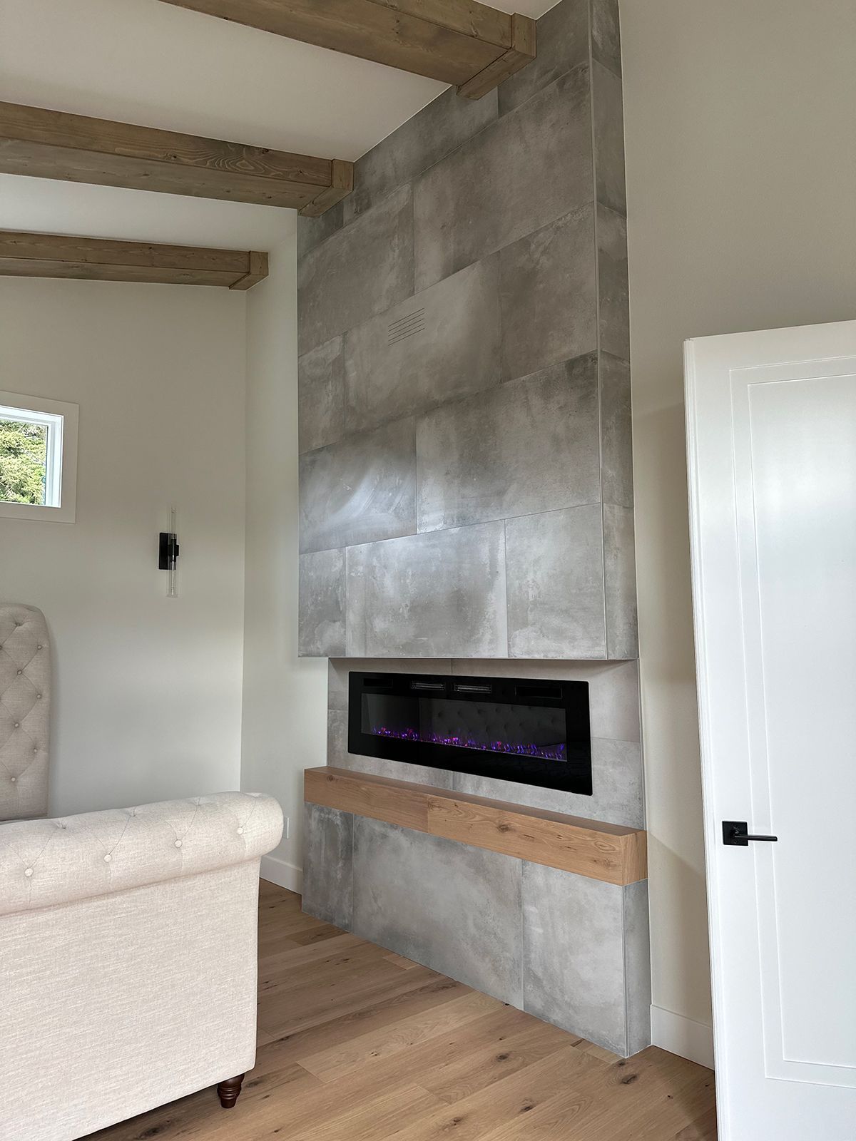 A living room with a fireplace and a couch.