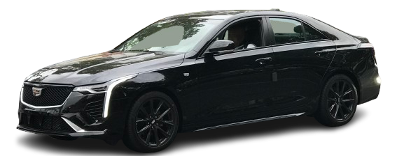 A black car is sitting on a white surface.