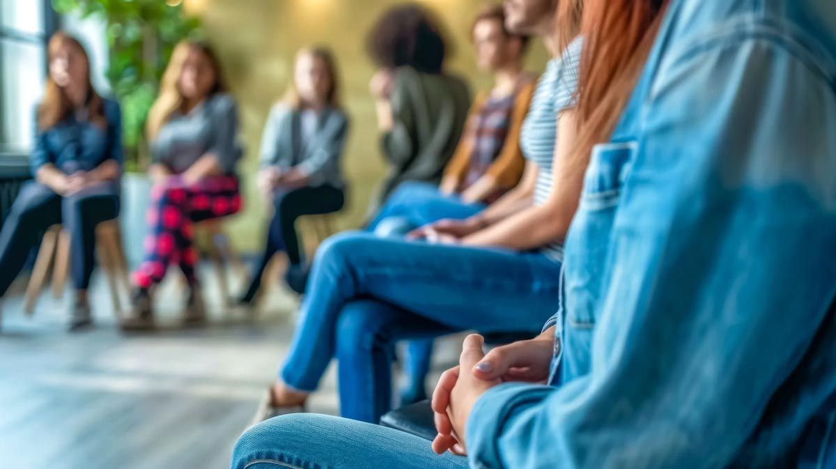 a group of people sitting in a circle