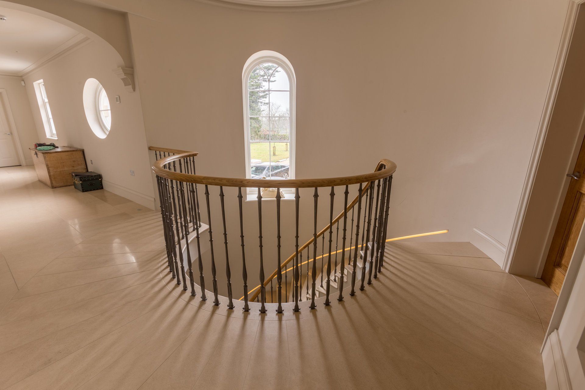 There is a spiral staircase in the middle of the room.