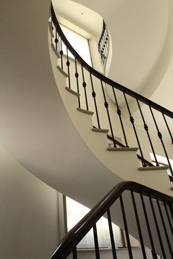 A spiral staircase with a window in the middle