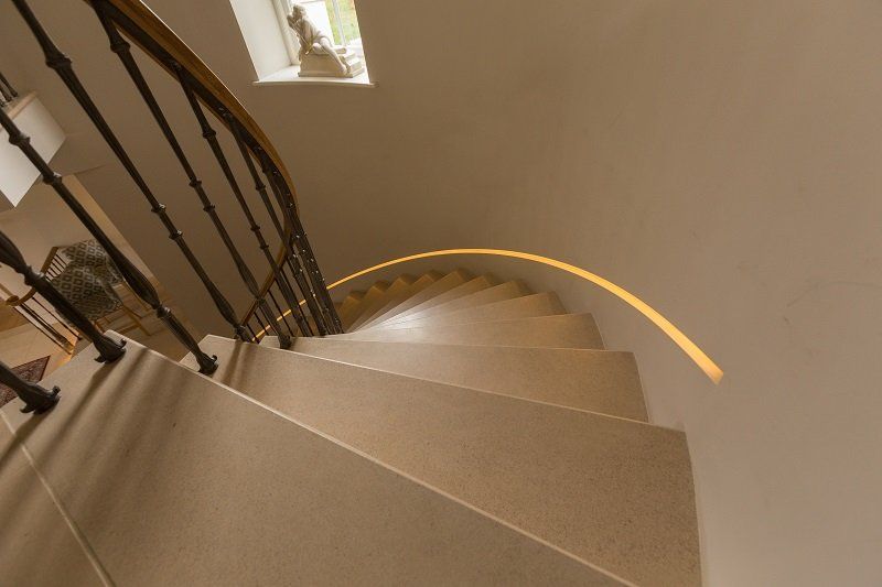 Looking down a spiral staircase with a railing