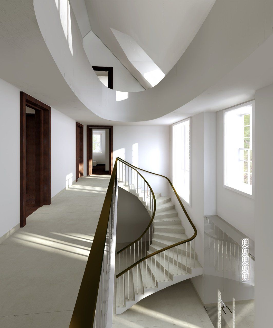 A curved staircase with a gold railing in a hallway