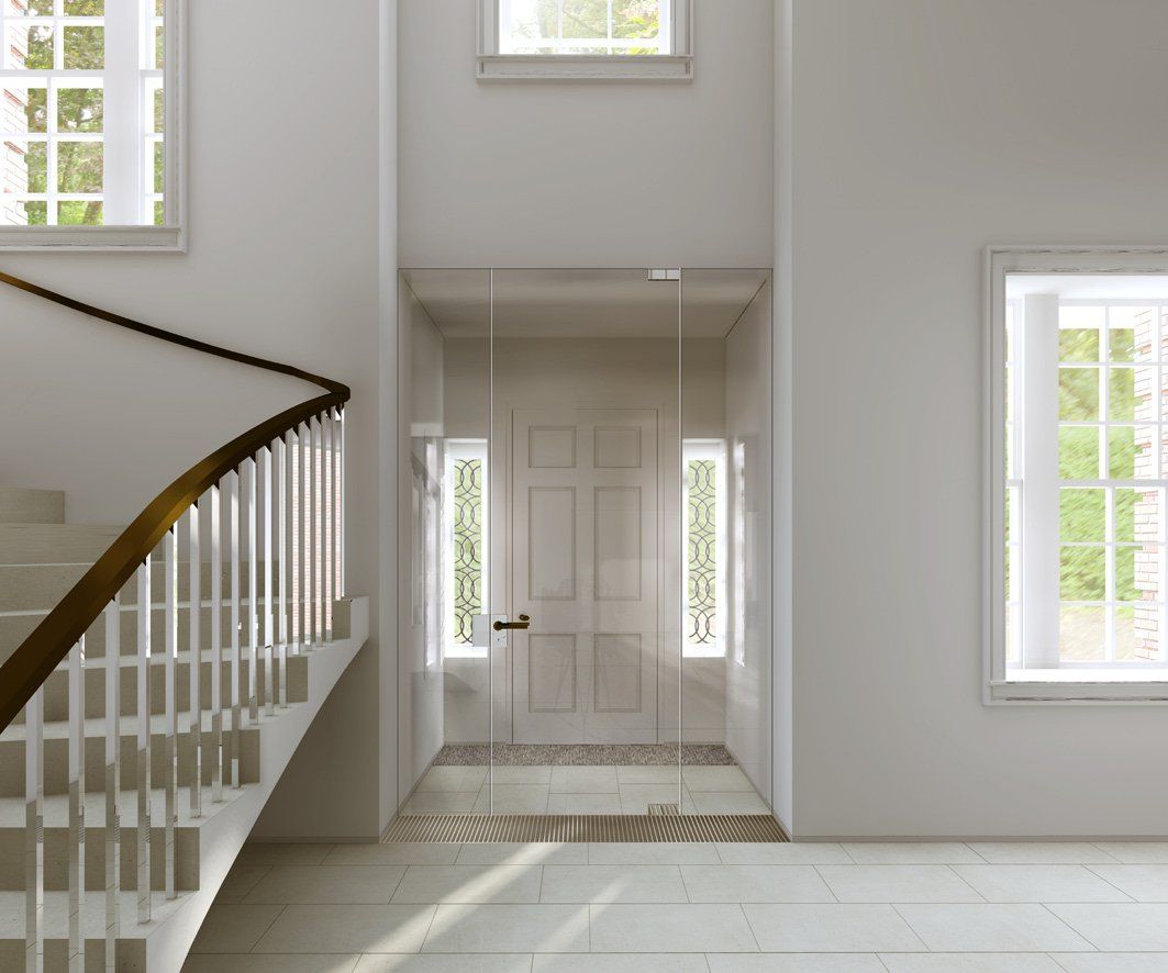 A staircase leading up to a door with a glass door