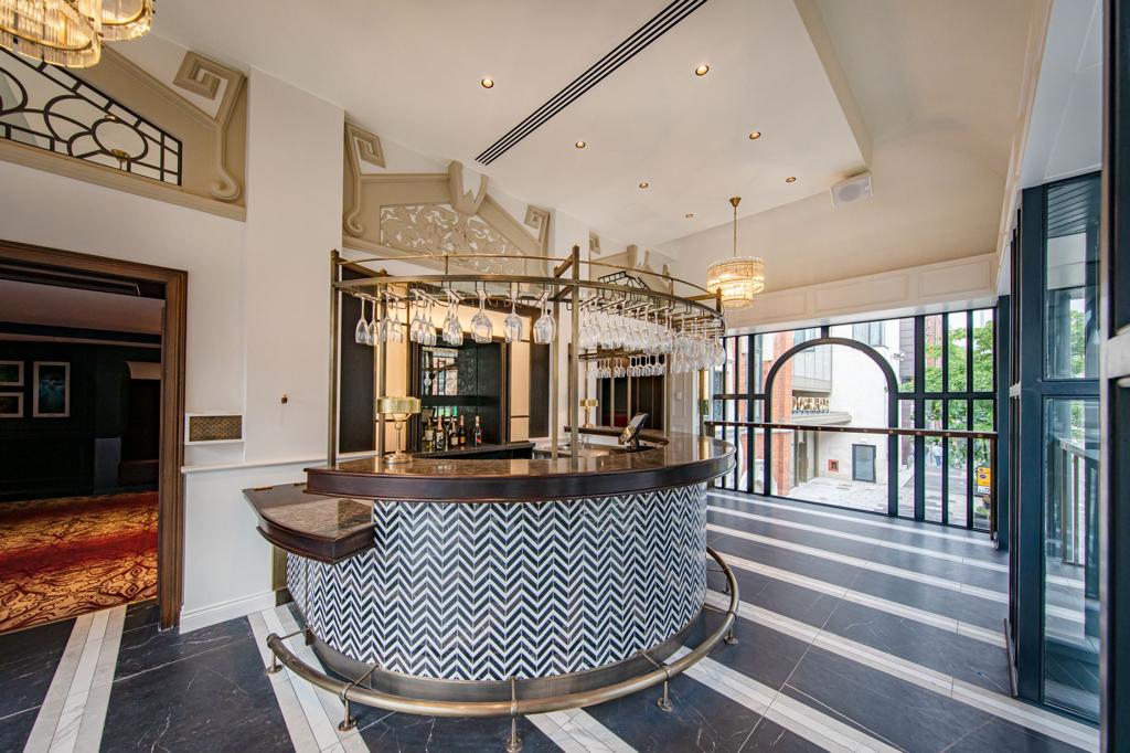 There is a large bar in the middle of the room.