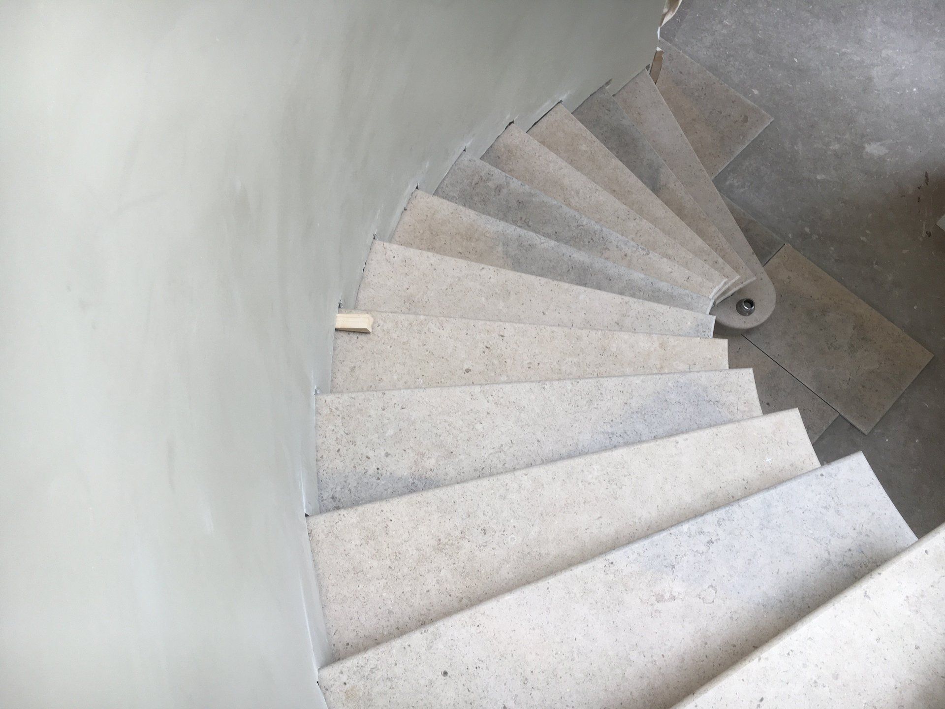 A close up of a spiral staircase in a building.