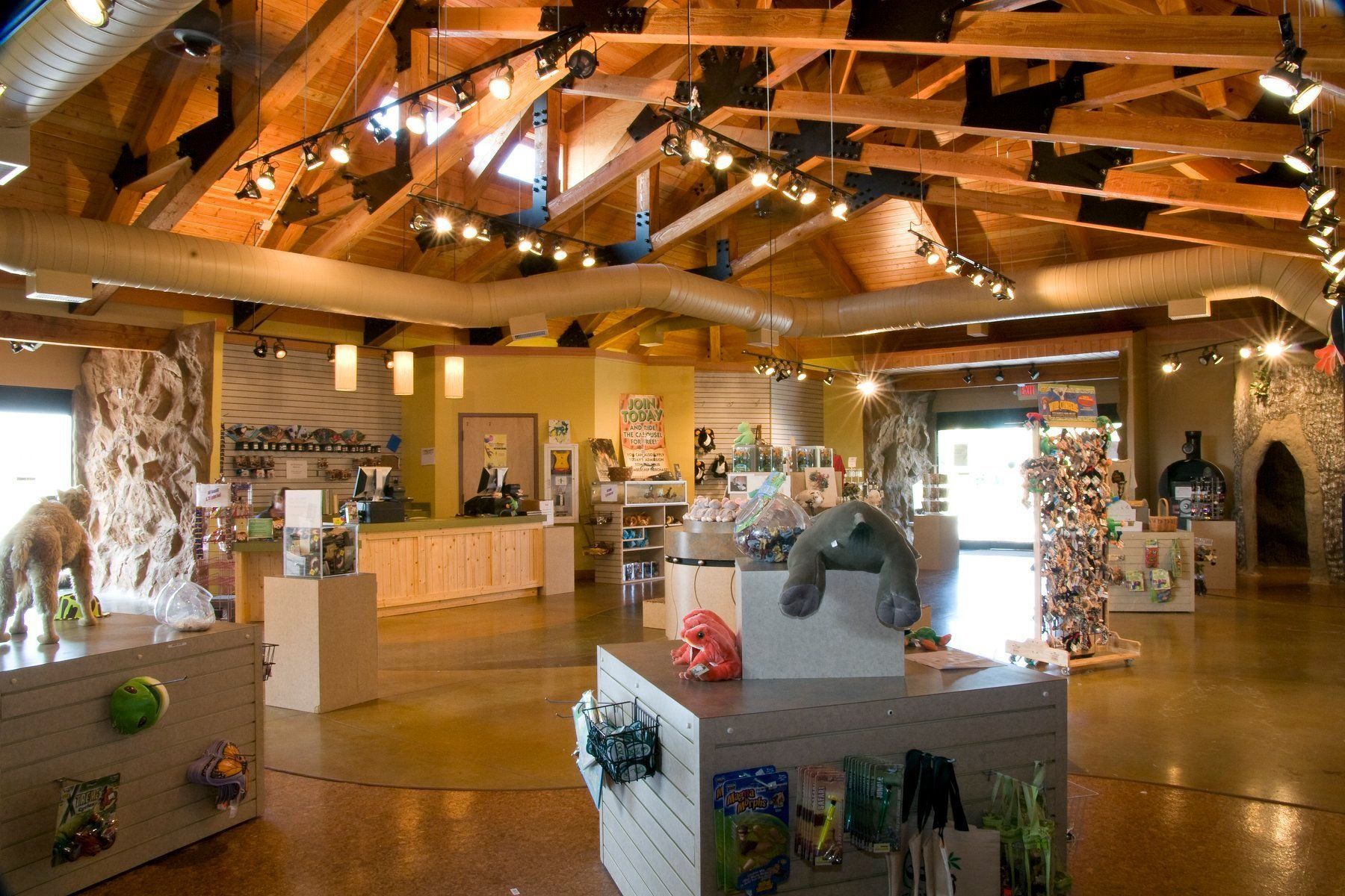 A large room with a lot of stuffed animals on display