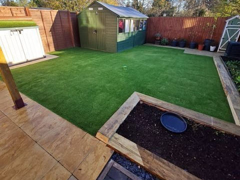 Wooden borders and artificial lawns showing landscaping services