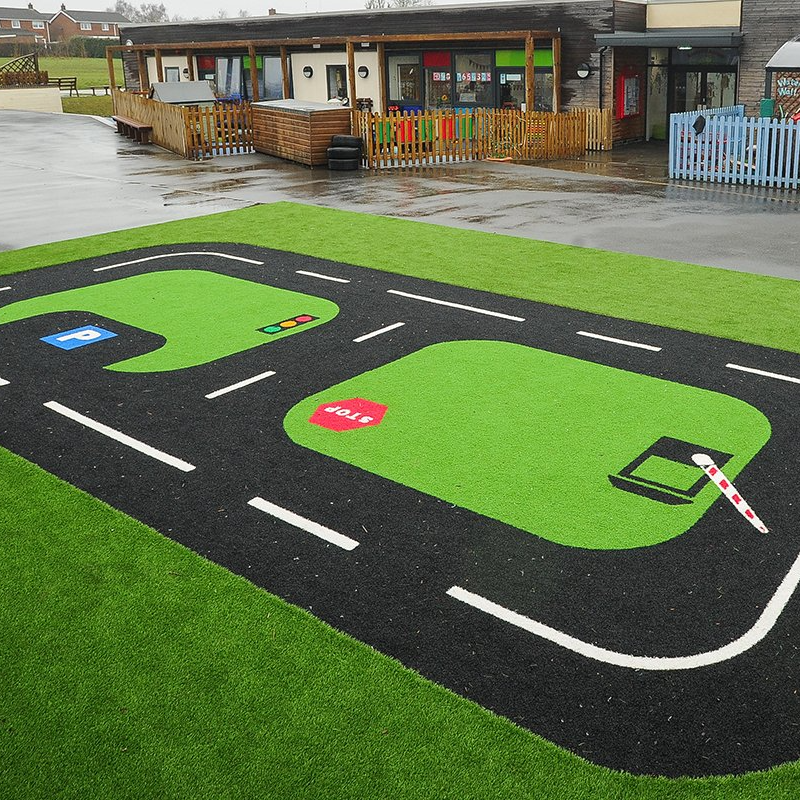 Artificial grass lawn play area showing landscaping services