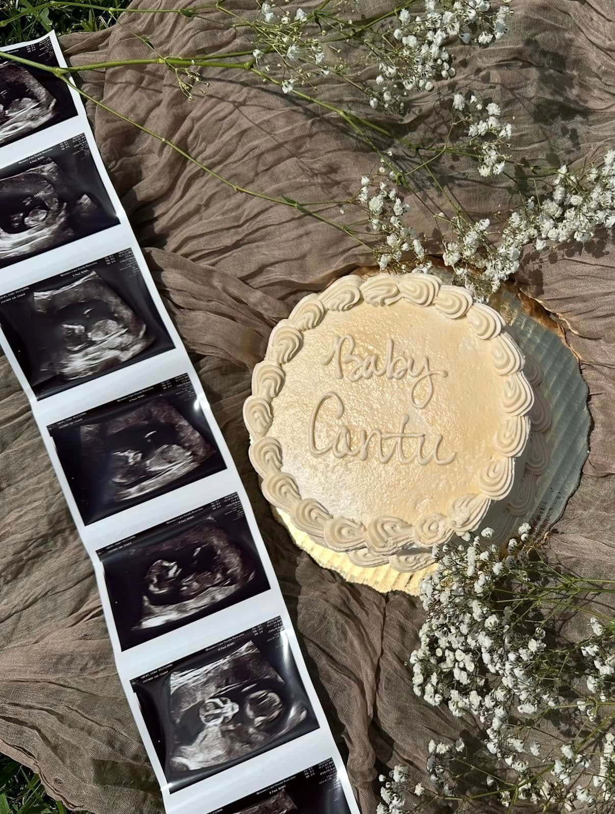 A cake is sitting next to a row of ultrasound images.