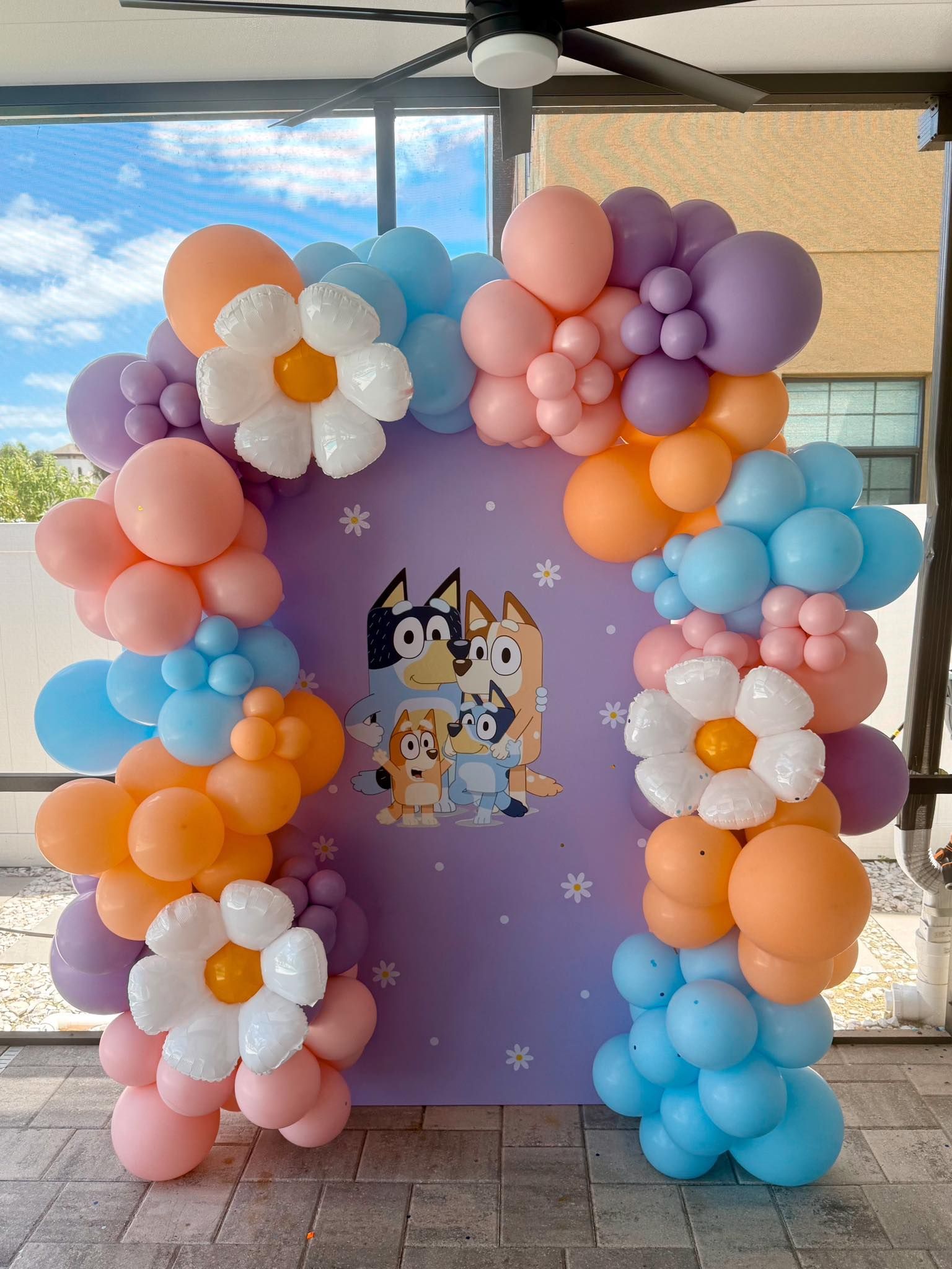 A bunch of balloons are sitting on top of a table.