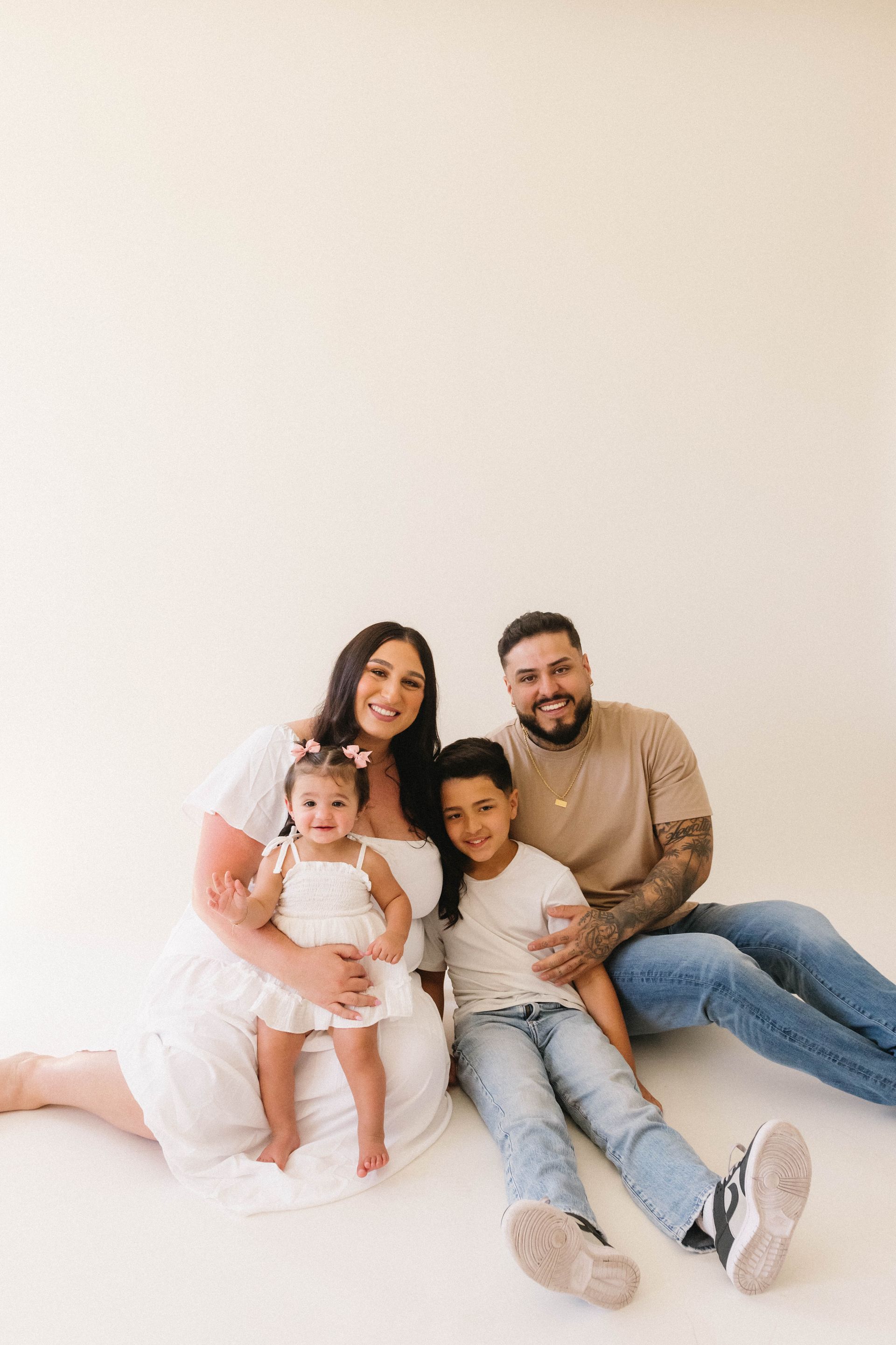 A sign that says holy cow i 'm one is surrounded by balloons.