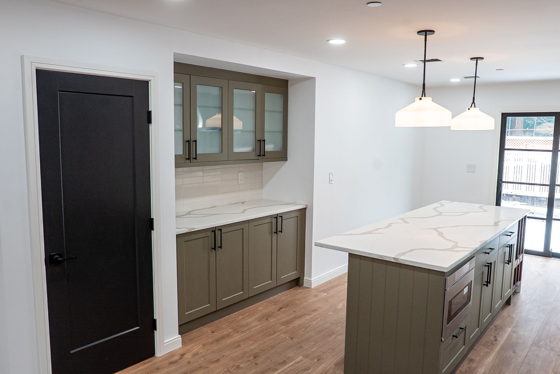 There is a large island in the middle of the kitchen