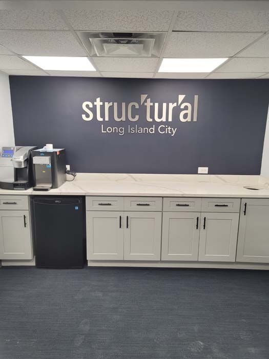 A kitchen with a sign that says structural long island city