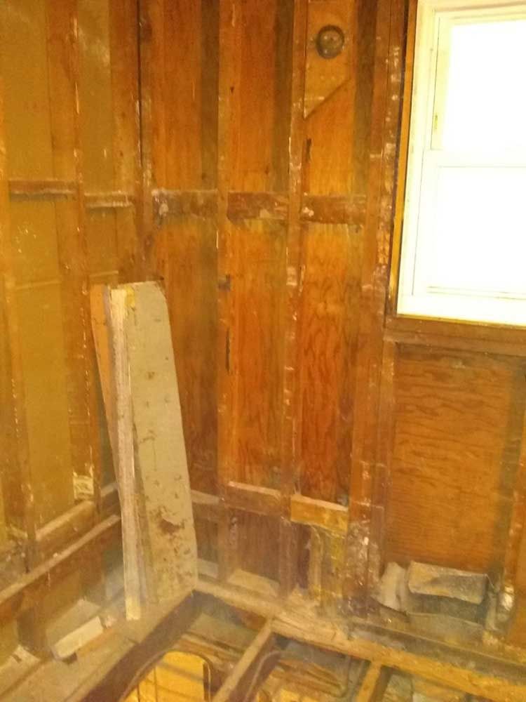 A room with wooden walls and a window