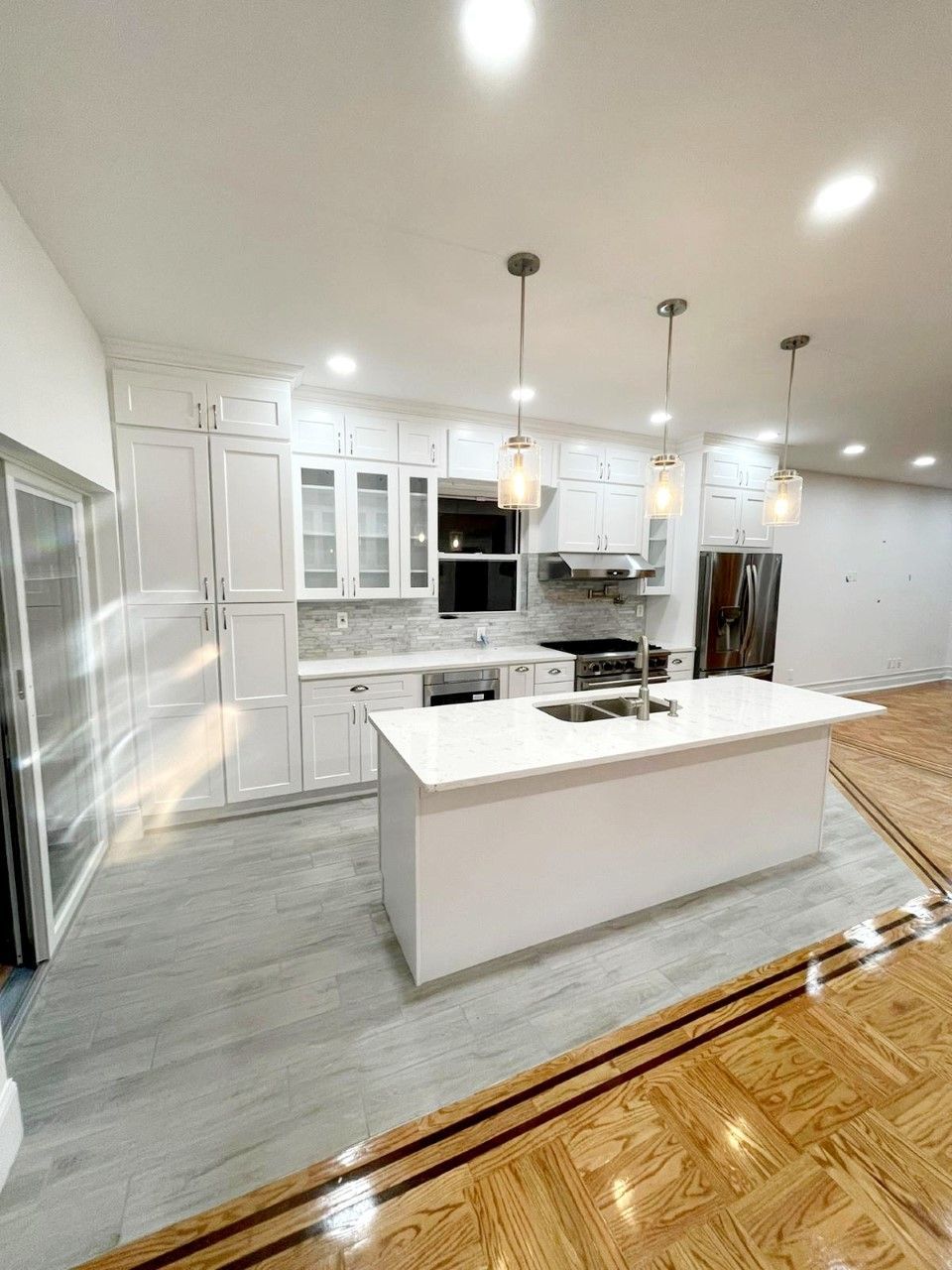 There is a large island in the middle of the kitchen