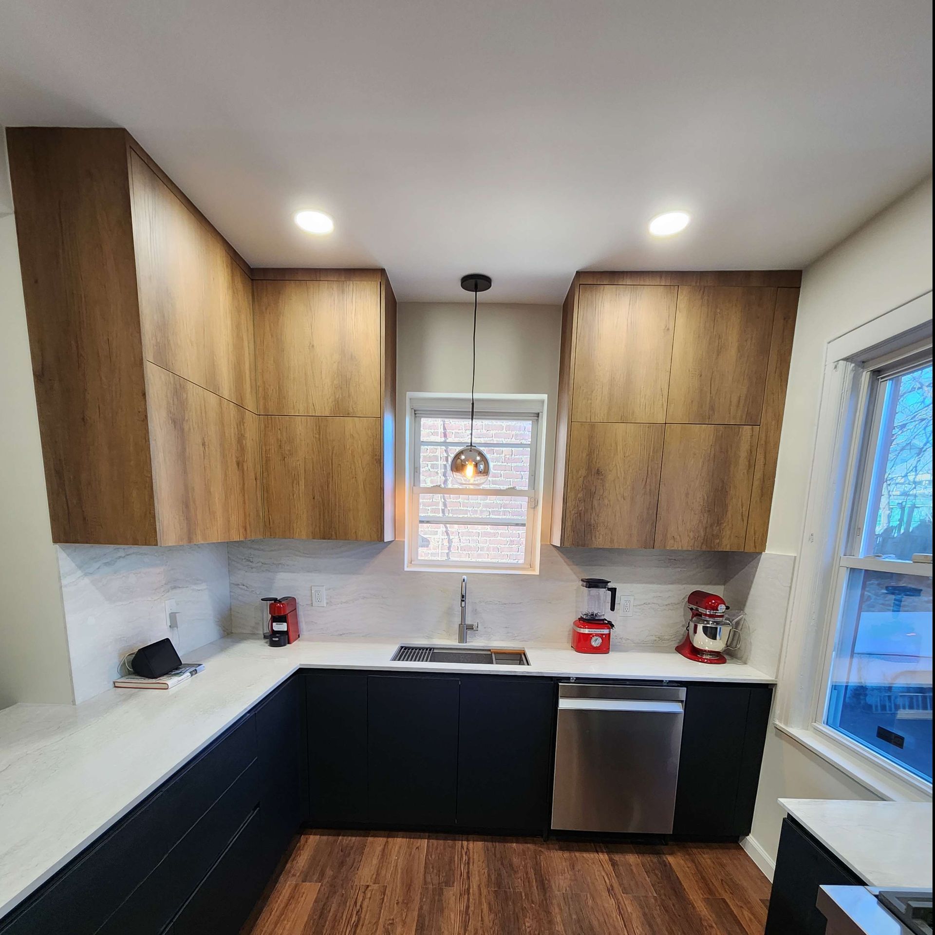 A kitchen with stainless steel appliances and wooden cabinets