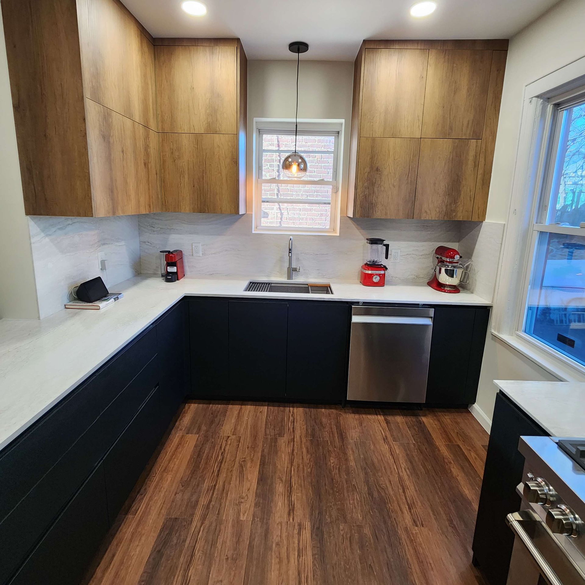A kitchen with stainless steel appliances and wooden cabinets