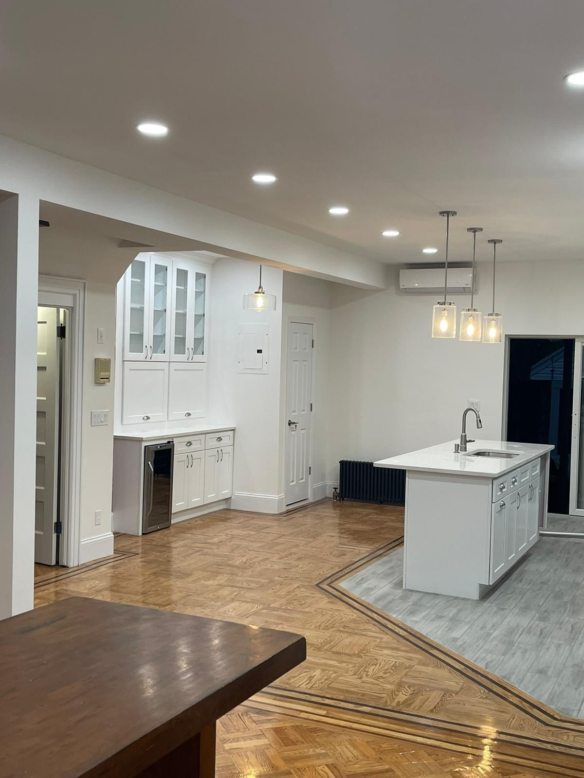 A kitchen with a large island in the middle of the room