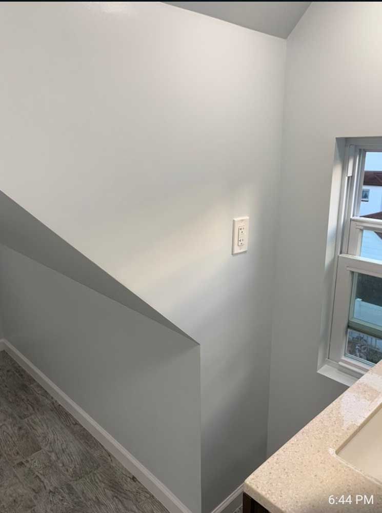 A bathroom with a sink and a window