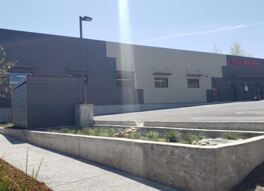 A large building with a parking lot in front of it