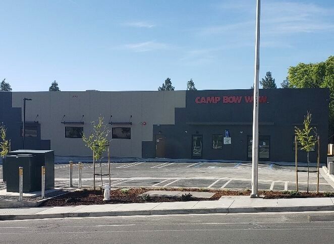 A large building with a parking lot in front of it.