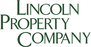 The logo for lincoln property company is green and white.