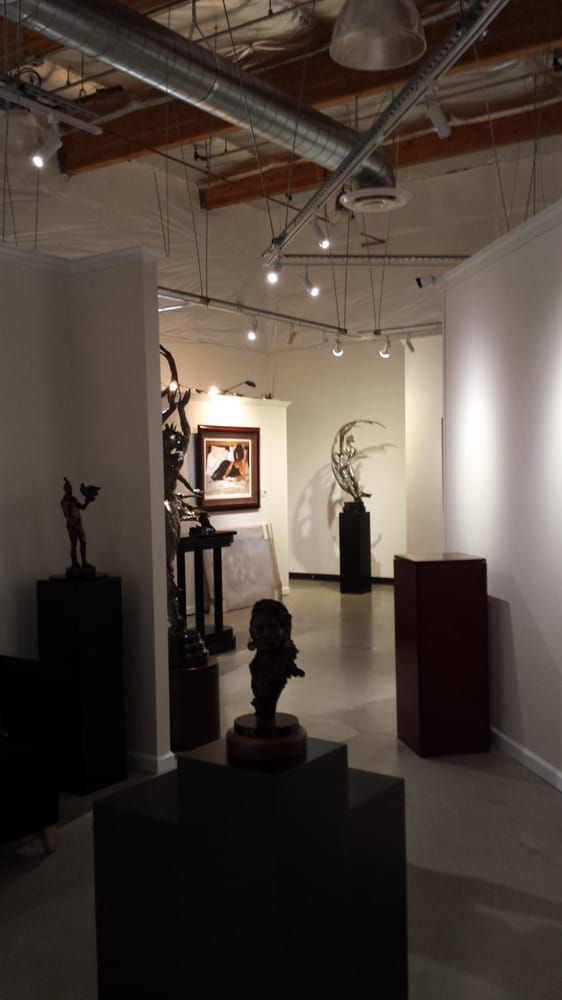 A large room with a lot of sculptures on display