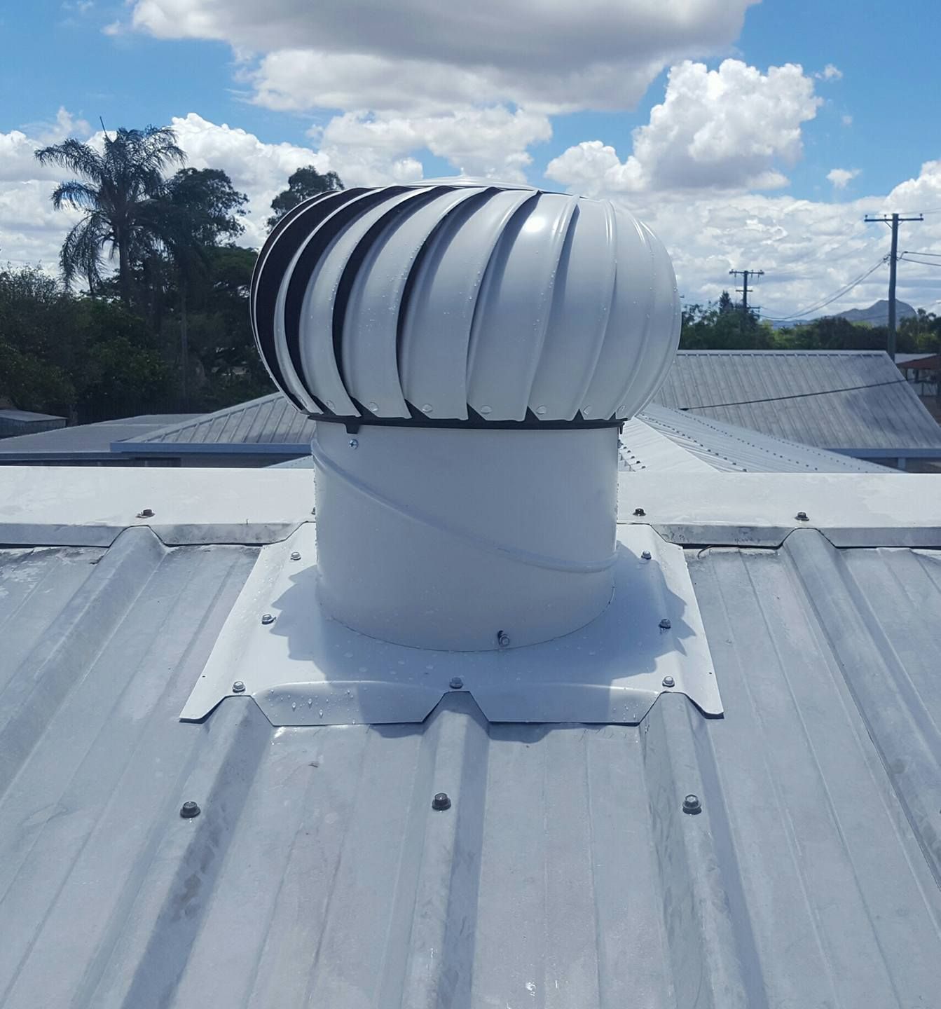 Electric drill used on new roofs with Metal Sheet — Roof Replacement in Jensen QLD