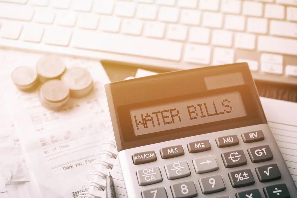 Calculator with water bill — Plumbers in Jensen QLD