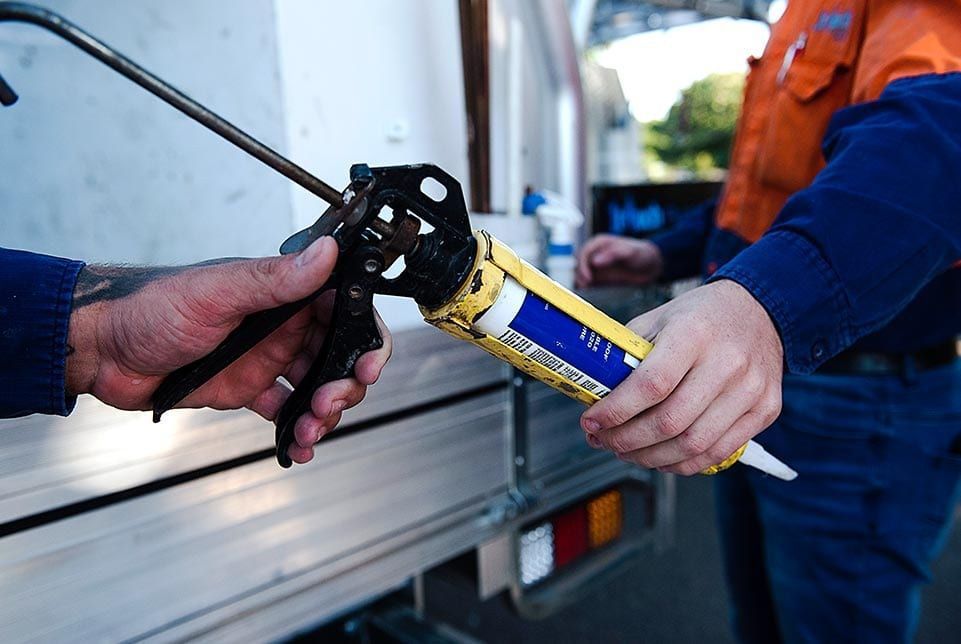 man holding emergency plumbing equipment