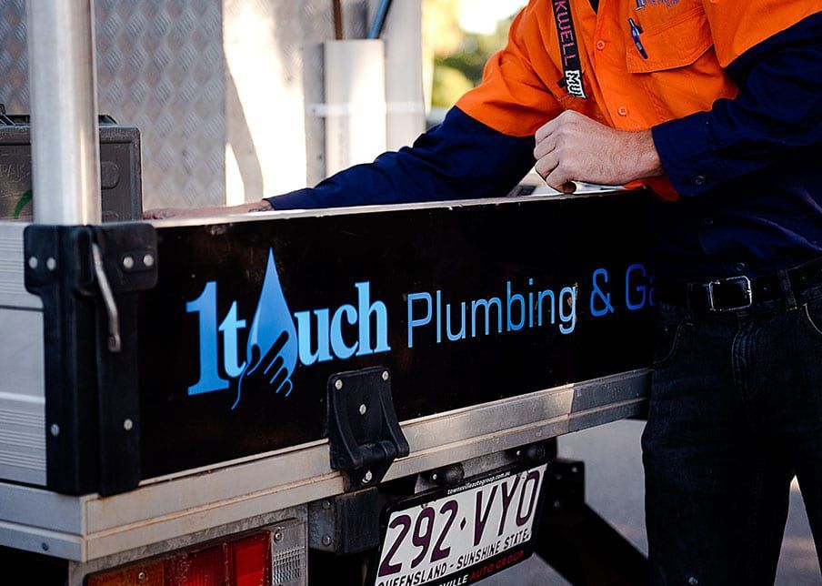 Townsville Plumber Picking Something on Truck