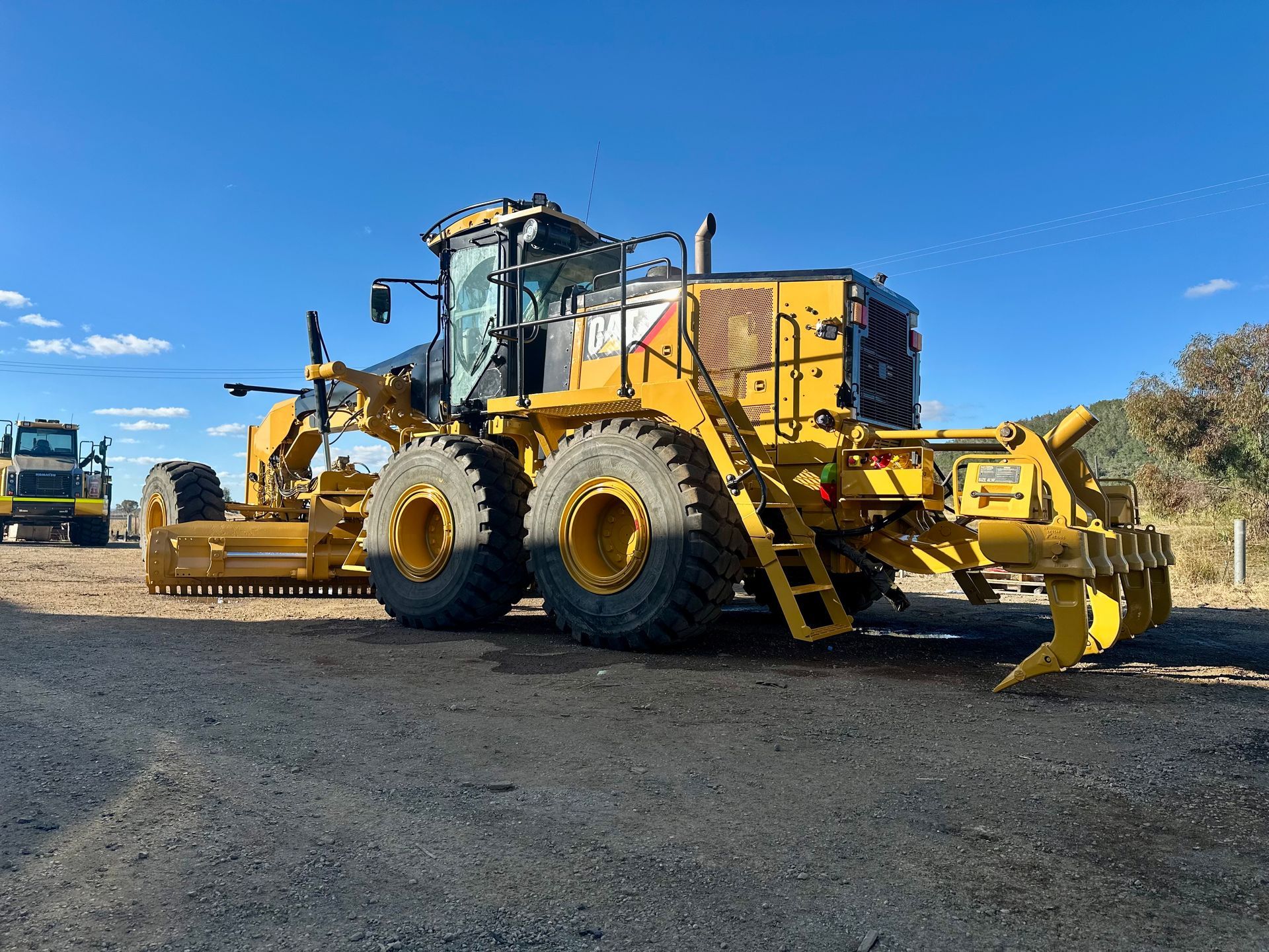 Large yellow industrial tank on a trailer, labeled
