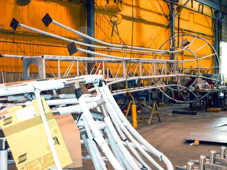 polished stainless steel custom architectural light towers branson landing