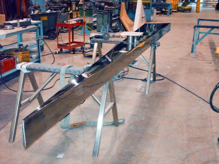 polished stainless steel shard sculpture shattering silence ornamental architectural