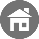 White house icon in a gray circle.