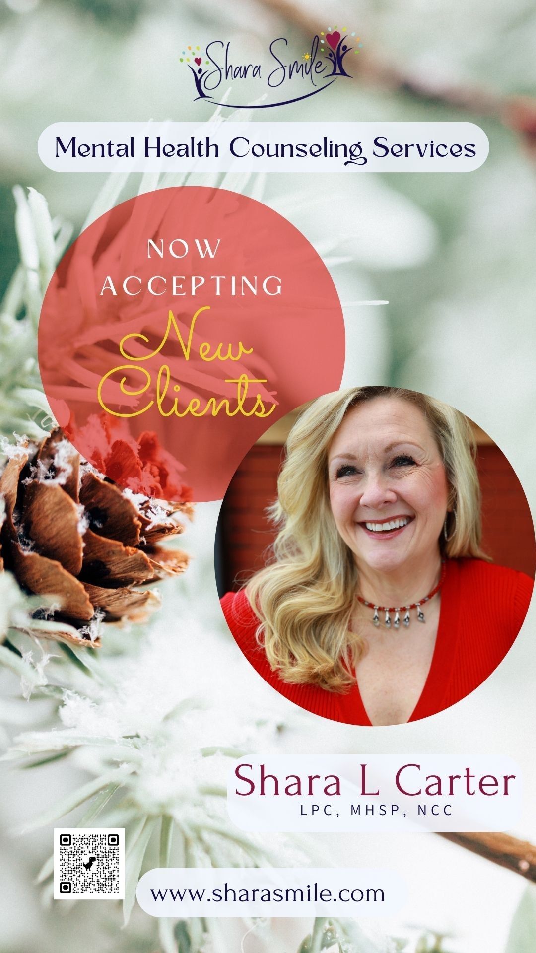 A woman in a red shirt is smiling in front of a pine cone.