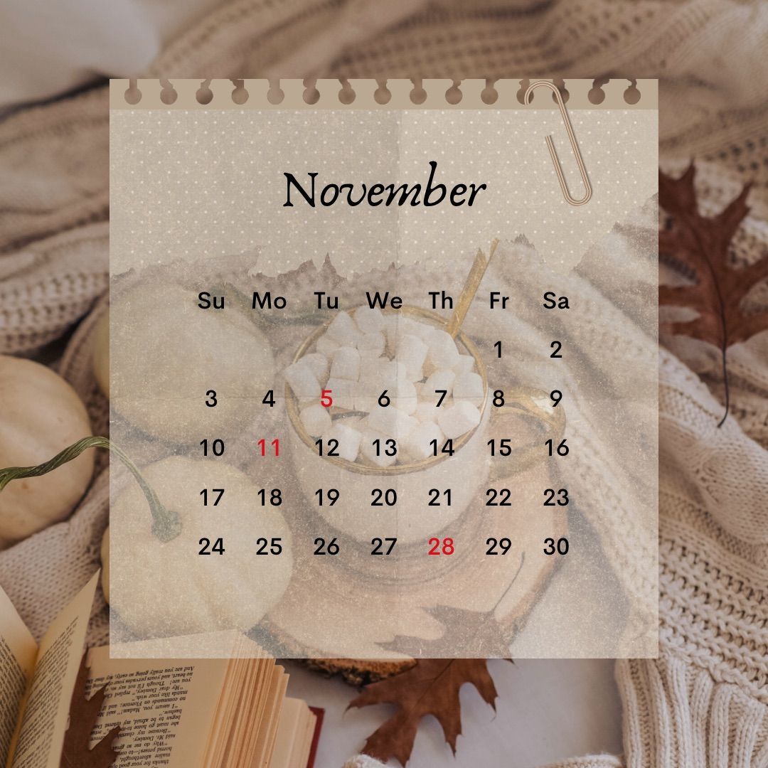 A calendar for october with pumpkins and a candle