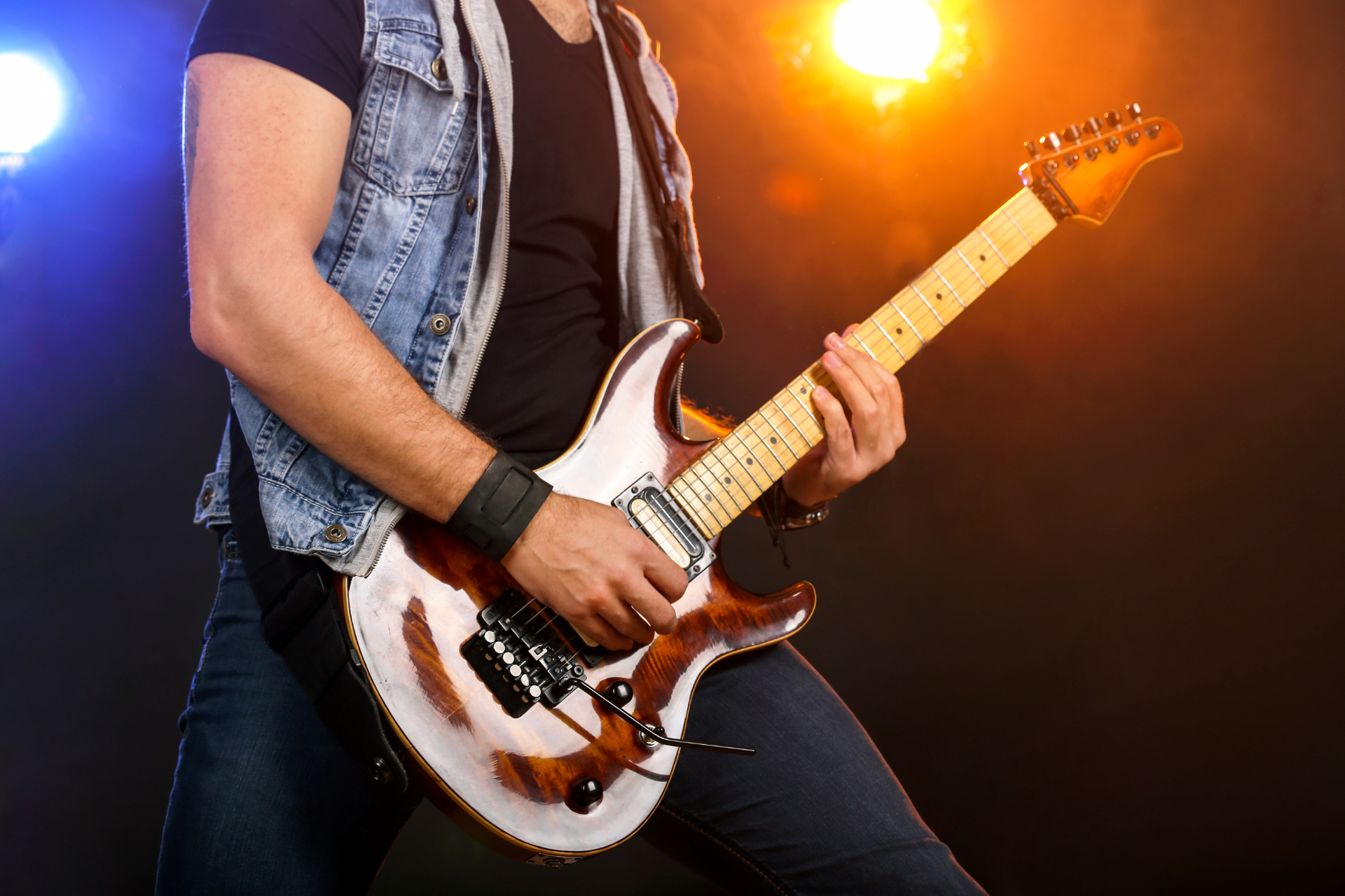 Man playing guitar  in rock band