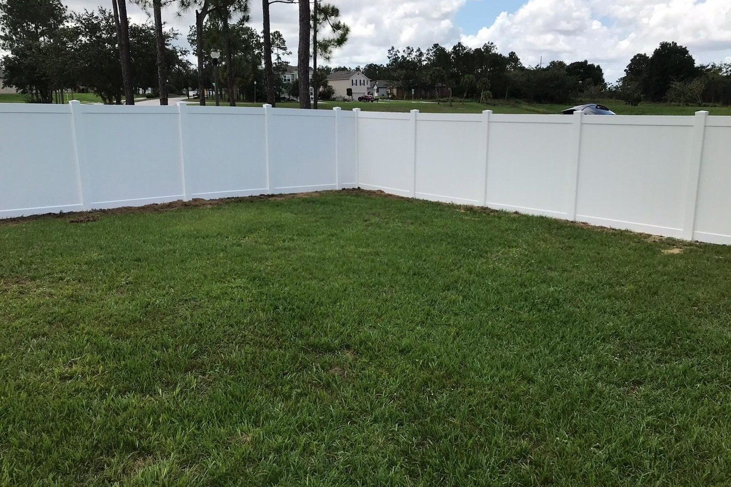 Backyard White Vinyl Fence — Tavares, FL — Allstar Fence Florida