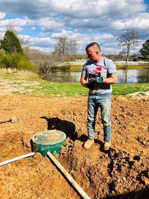 Septic Tank — Worker Inspecting Septic Tank In Harvest, AL