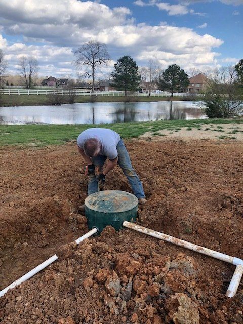 Septic Tank Repair — Worker Installing Septic Tank In Harvest, AL