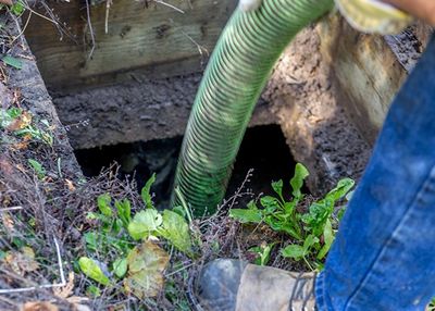 Septic Tank  Pumping — Worker Emptying Septic In Harvest, AL