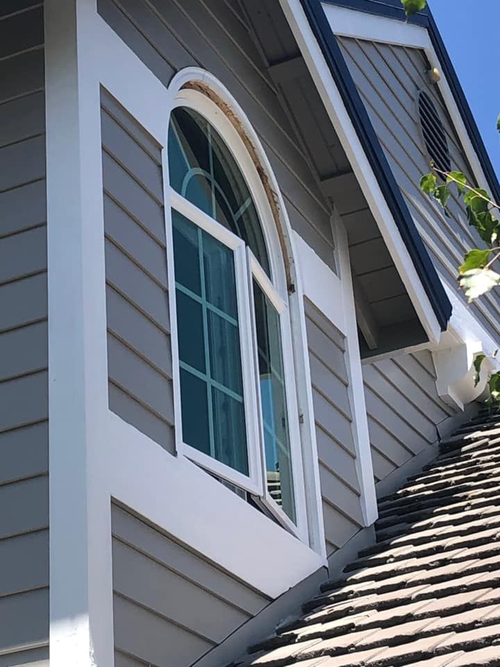 A house with a large window on the side of it