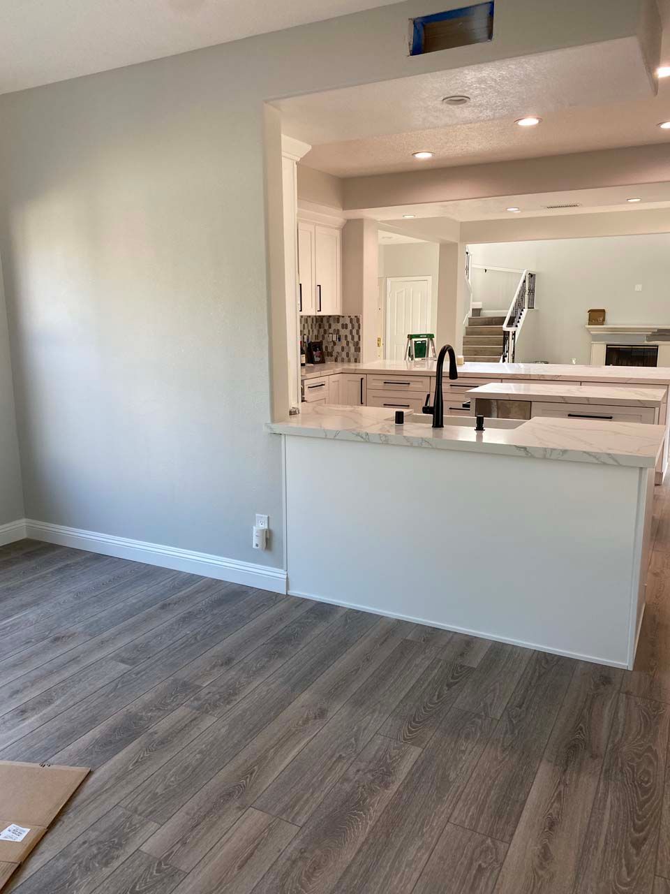 A kitchen with a large island in the middle of the room.