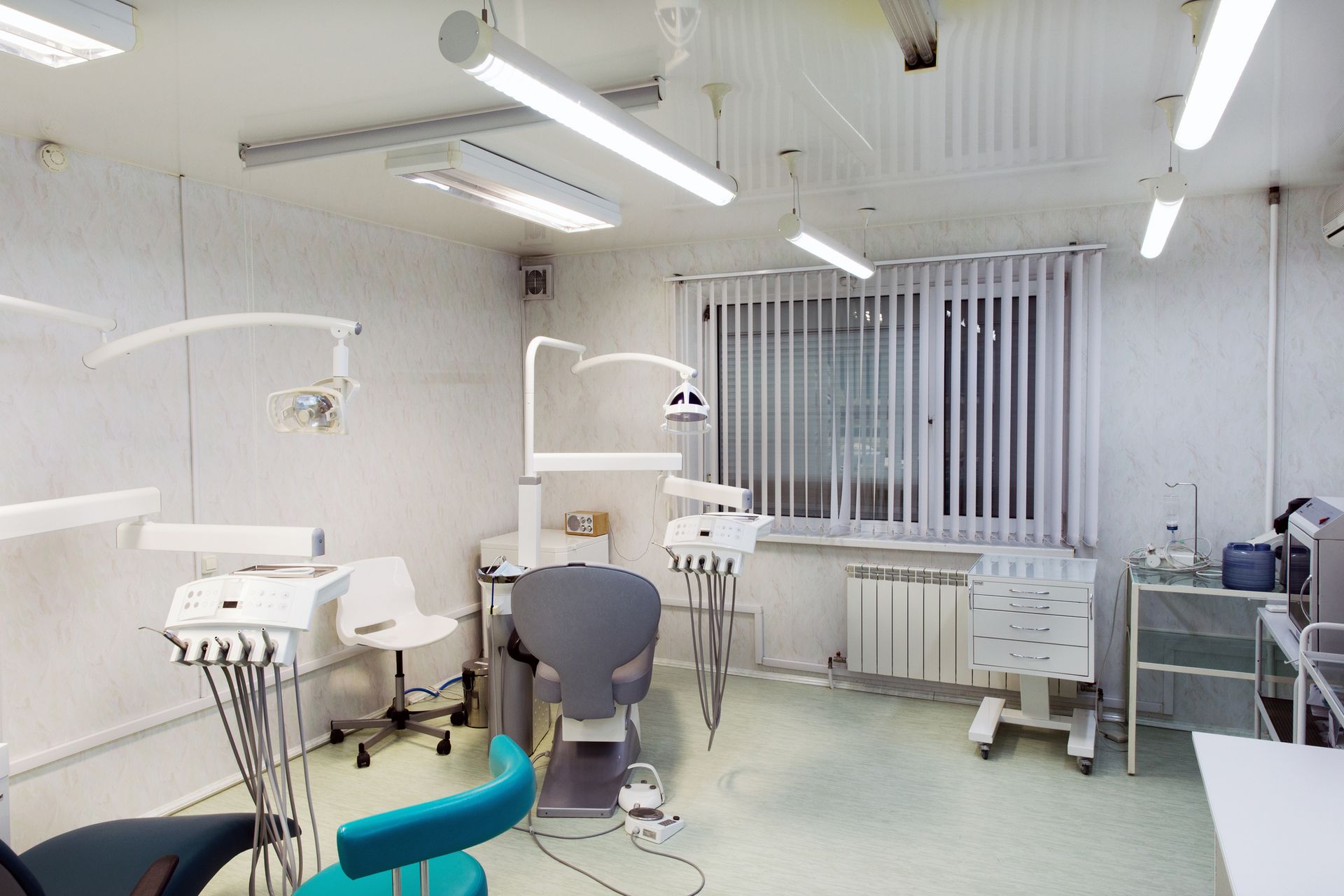 A dental office with a dental chair and dental equipment.