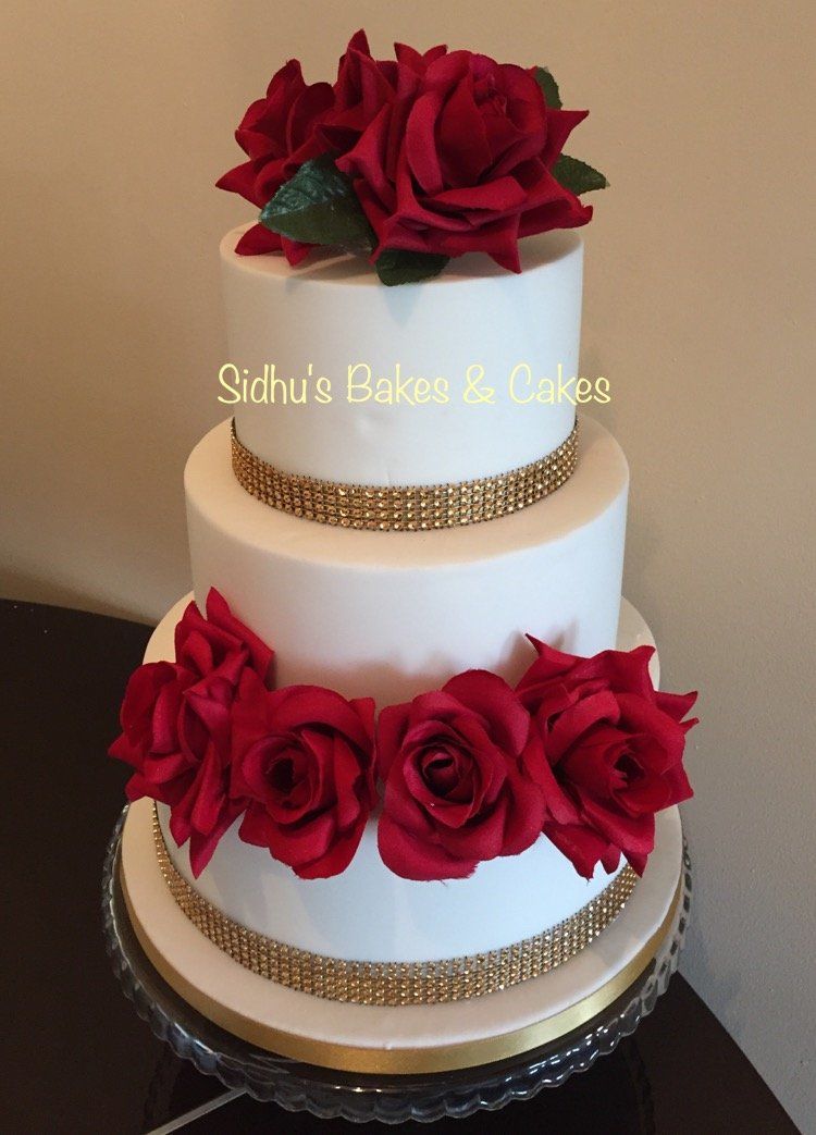wedding cake with edible red roses