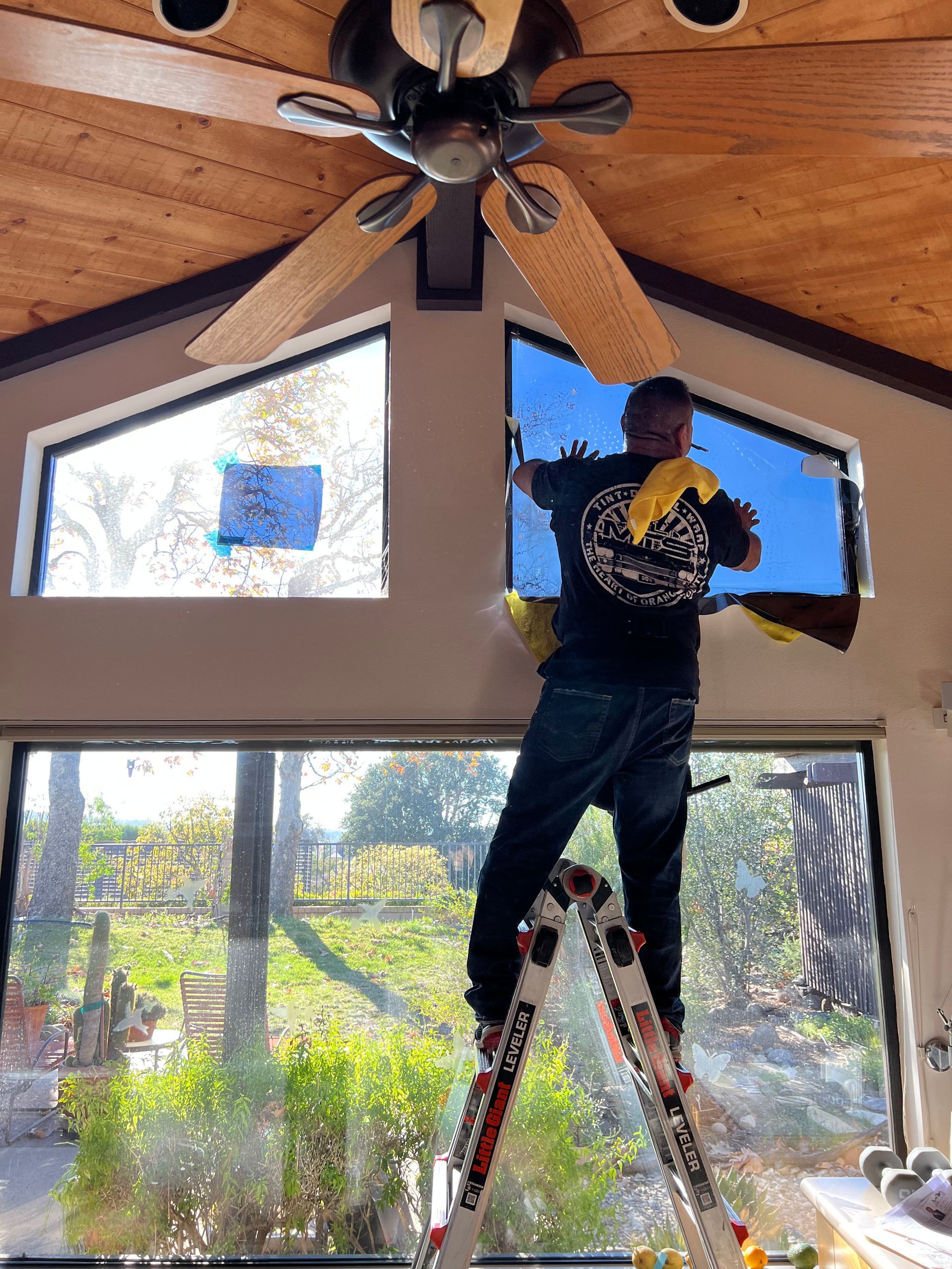 A large white house with a swimming pool in front of it.