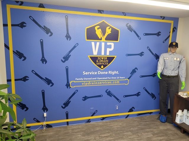 A man is standing in front of a wall that says vip