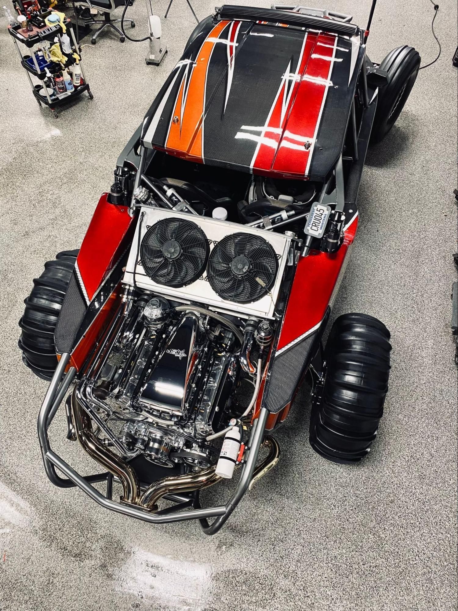 Person applying tinted film to a car window.